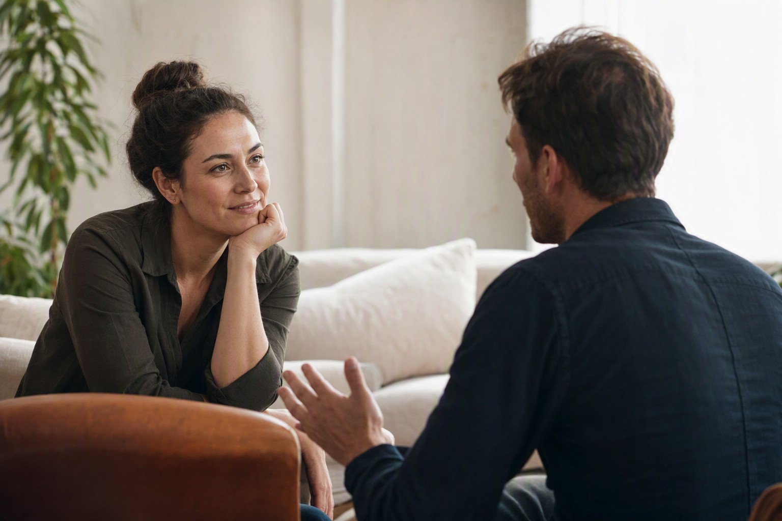 Two people deep in an honest conversation, listening to each other without distraction.
