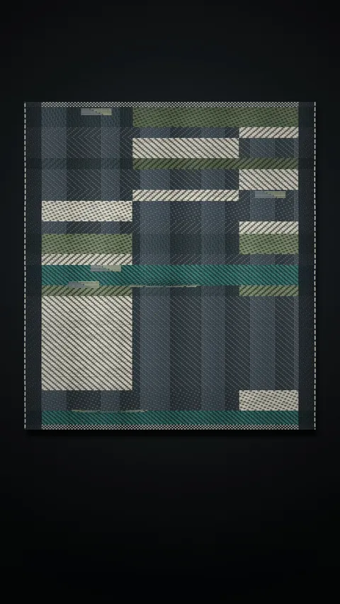 Loom: a woven panel of slate, green and cream checks on a dark ground.