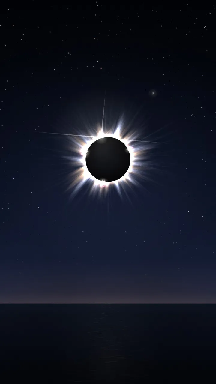 Totality, from a lively conversation: a black moon covers the sun, ringed by a bright white corona in a dark blue sky above a still horizon.